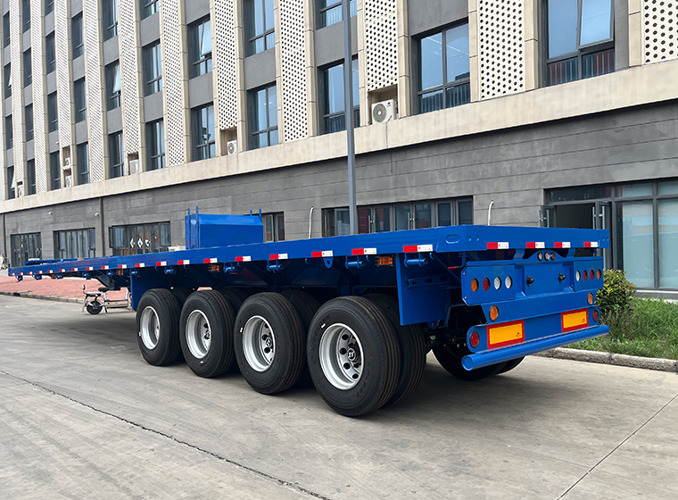 Blue semi-trailer outside the factory
